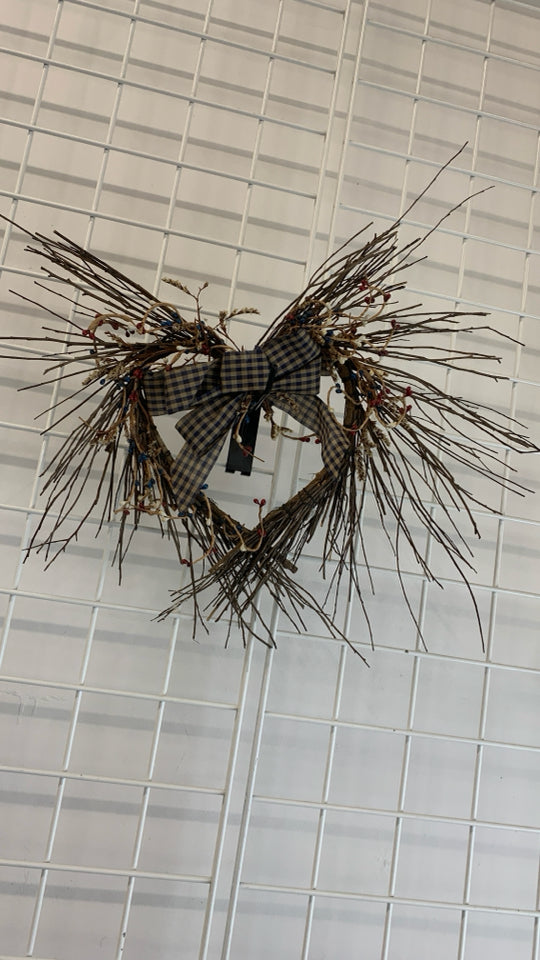 HEART SHAPED TWIG WREATH W/RED/WHITE/BLUE PIP+PLAID BOW.