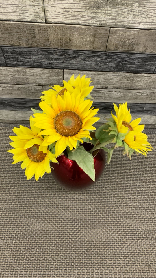 RED GLASS VASE W/FAUX SUNFLOWER BOUQUET.