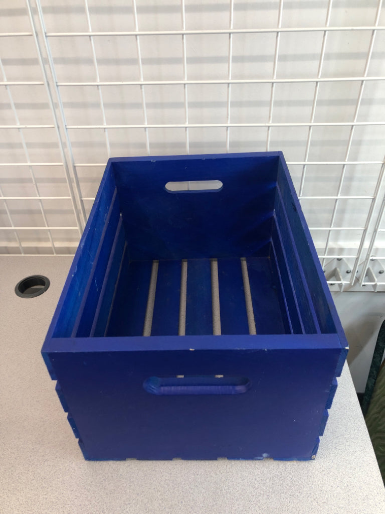 BLUE WOODEN CRATE.