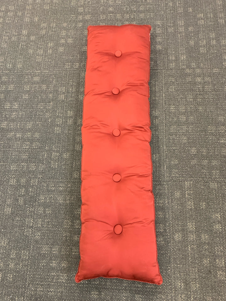 RED TUFTED BENCH CUSHION.