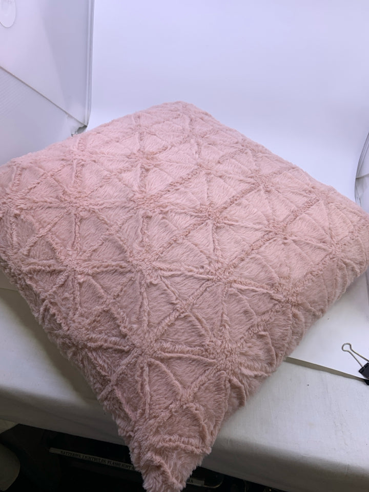 PINK FUZZY PILLOW W/ TRIANGLE DESIGN.