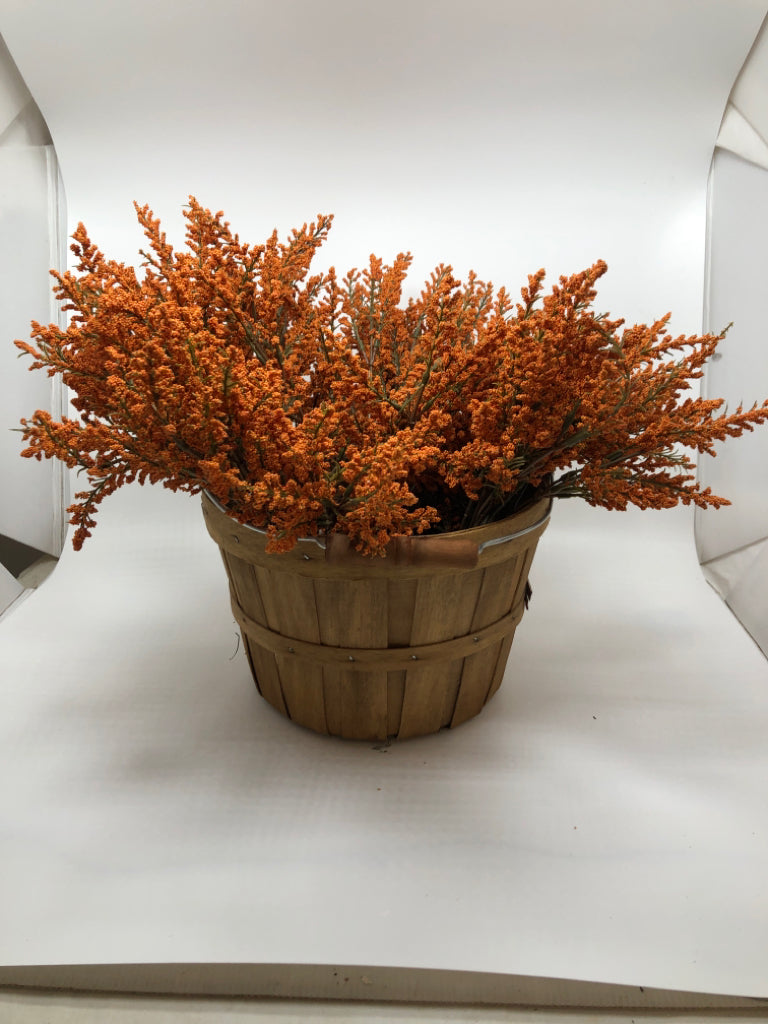 ORANGE PIP IN BUSHEL BASKET.