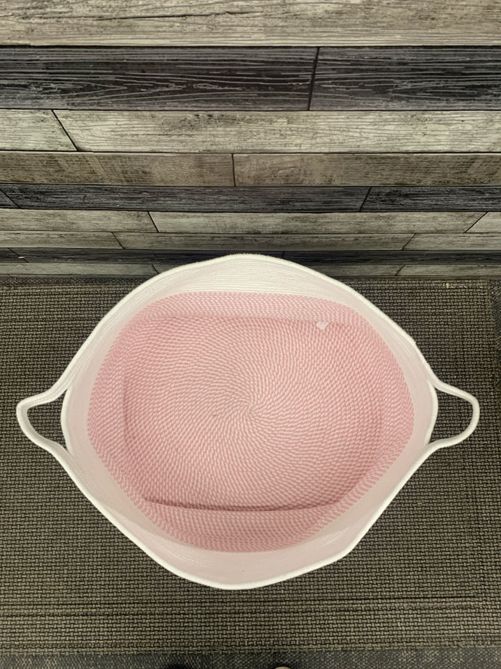 LARGE WOVEN PINK/WHITE BASKET.