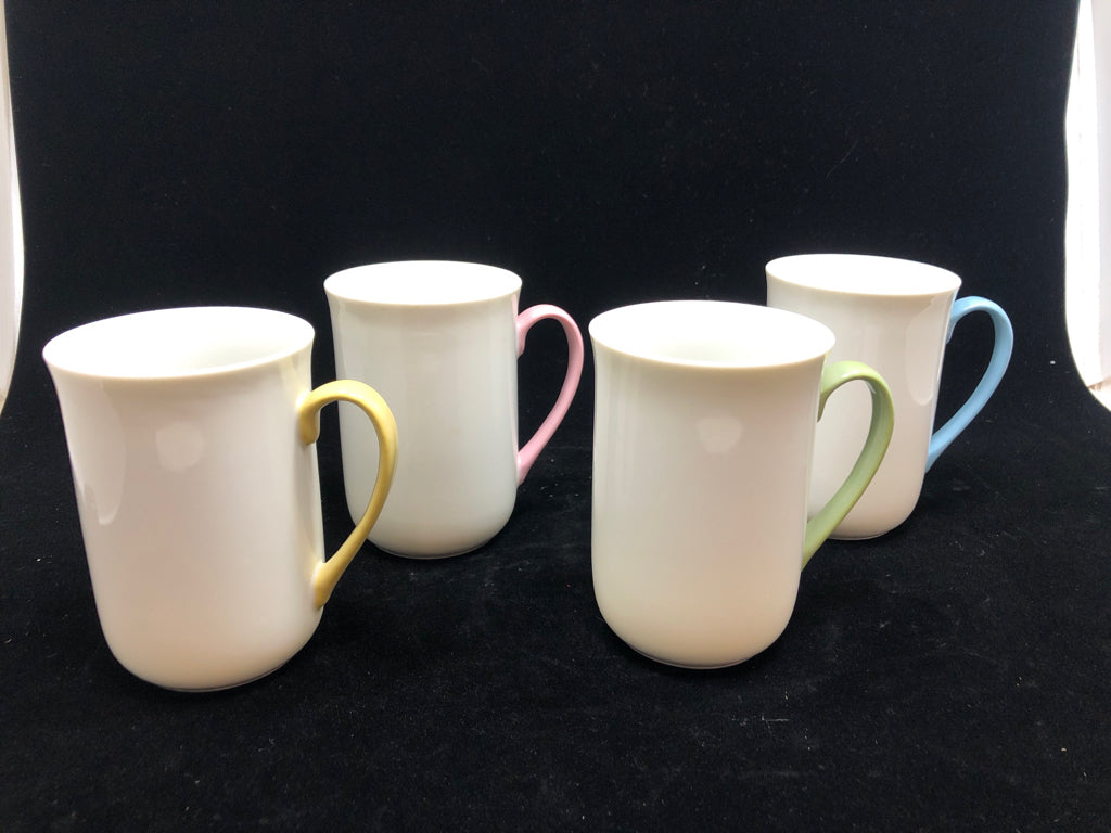 4 WHITE MUGS W/MULTI COLORED HANDLES.