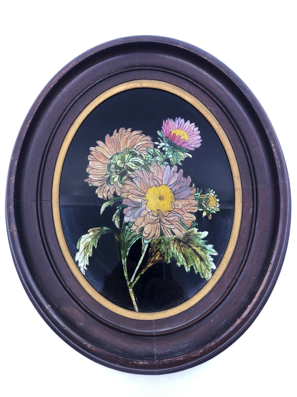 3 FLOWERS IN ROUND WOOD FRAME WALL HANGING.