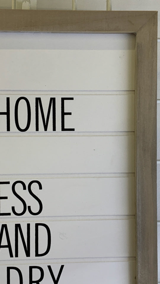 WHITE WASHED FRAME THIS HOME WALL HANGING.