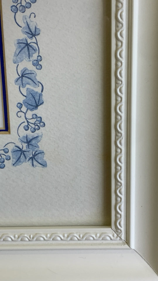 BLUE FLOWERS IN WHITE BACKGROUND IN WHITE FRAME WALL ART.