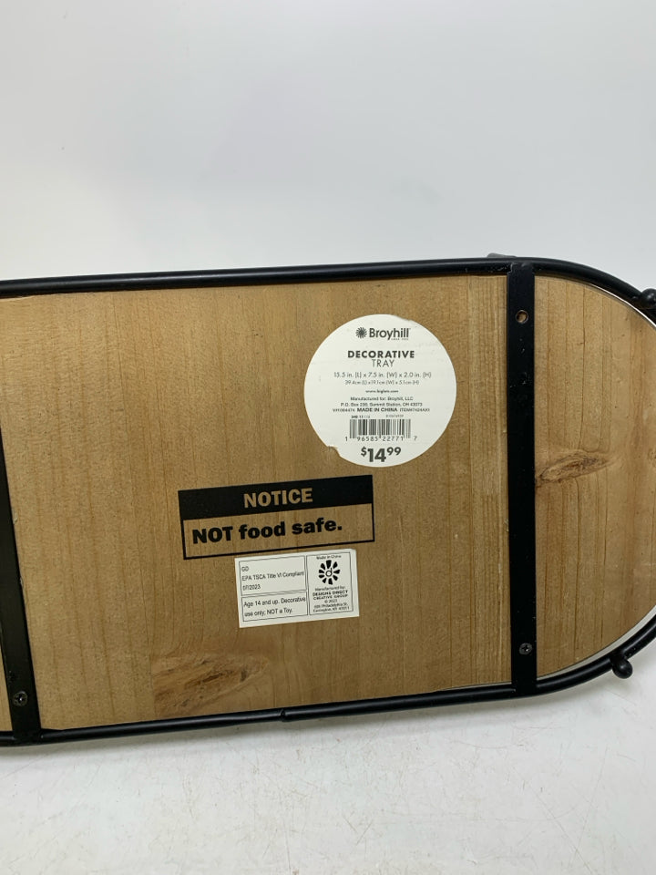 OVAL WOOD TEXTURED BASED W/ BLACK METAL BOARDER.
