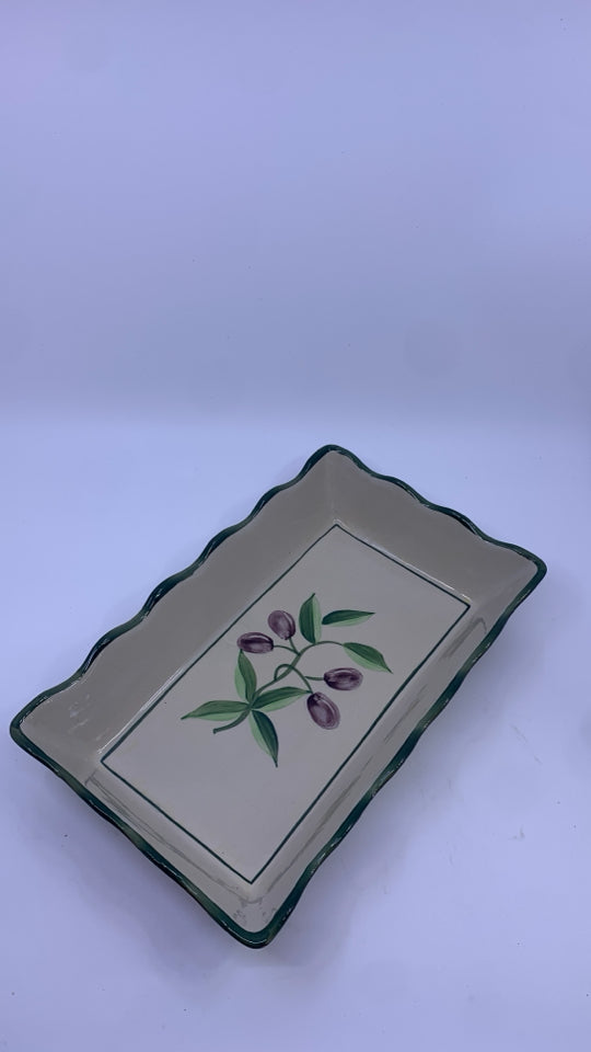 OLIVE CASSEROLE DISH IN METAL HOLDER.