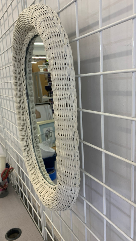 WHITE WICKER OVAL WALL MIRROR.