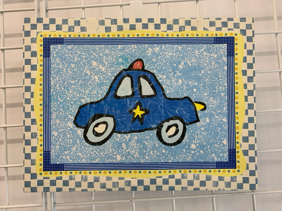 POLICE CAR W/CHECKERED BORDER CANVAS WALL HANGING.