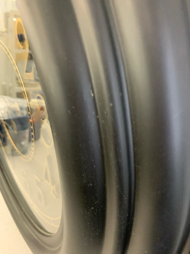 BLACK CLOCK W/BRASS PAINTED NUMBERS.