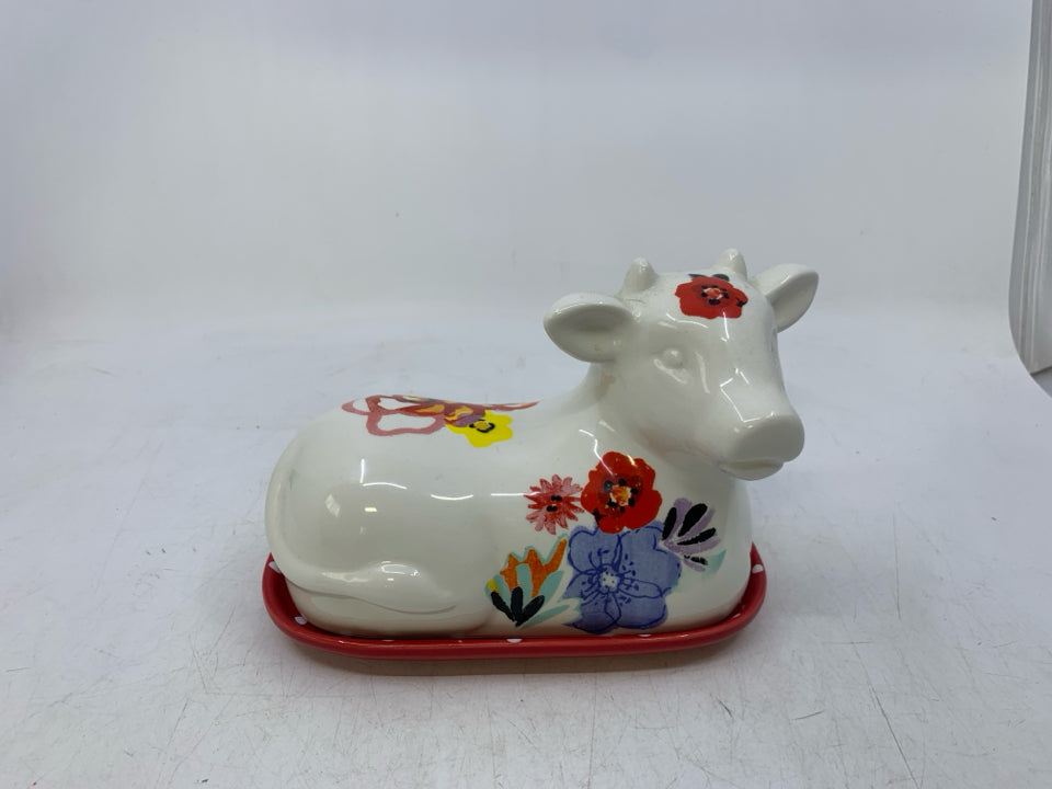 WHITE FLORAL COW SHAPED BUTTER DISH.
