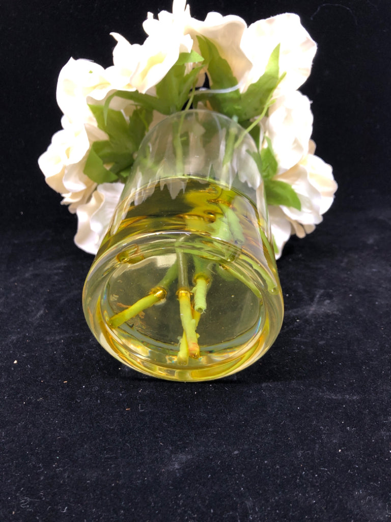 FAUX WHITE FLOWERS IN GLASS VASE.