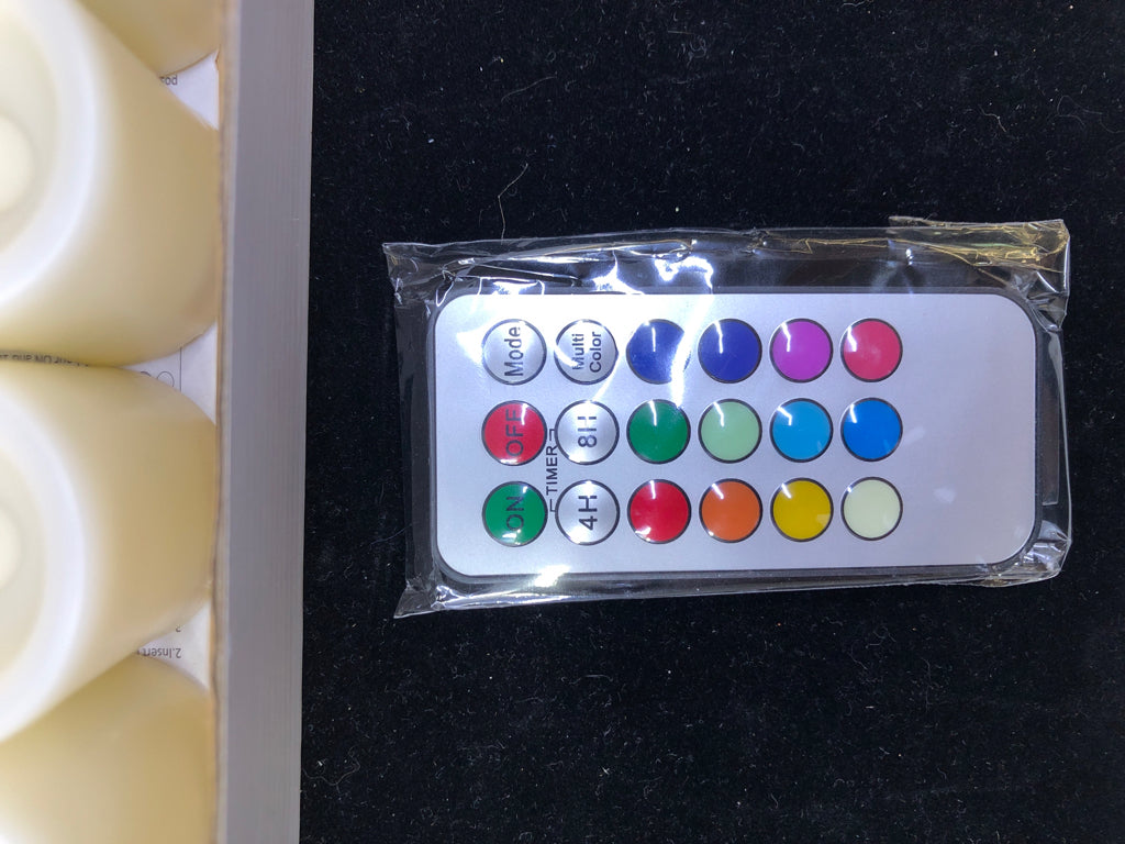 10PC FLAMELESS VOTIVE CANDLES IN BOX.