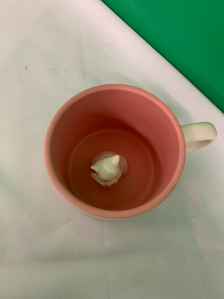 WHITE MATTE MUG W PINK BOWS AND WHITE CAT INSIDE.