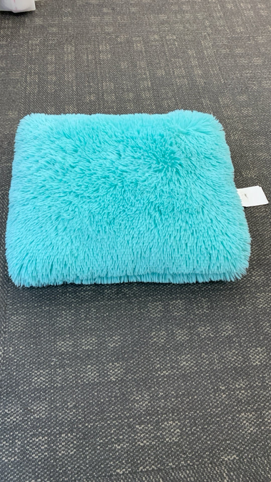 TEAL FURRY ACCENT PILLOW.