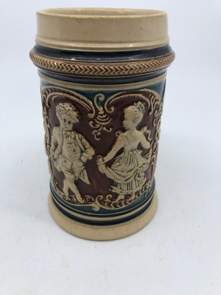 VTG EMBOSSED BOY AND GIRL DANCING STEIN.