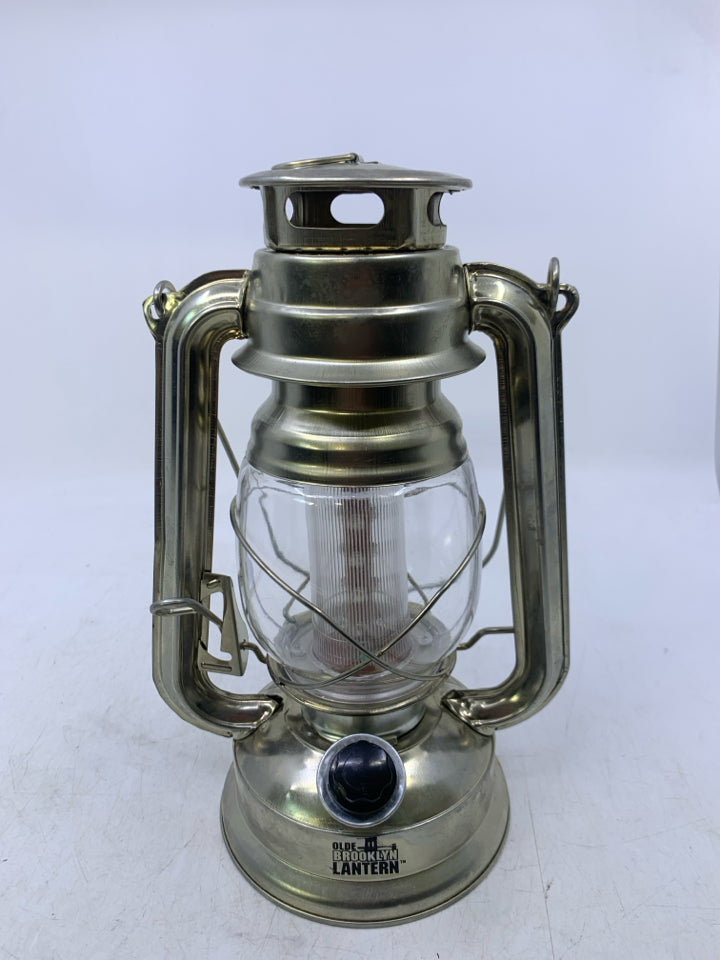 LIGHT WEIGHT SILVER METAL BATTERY POWERS LANTERN.