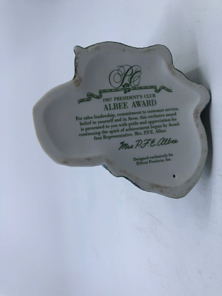 WOMAN IN GREEN DRESS W UMBRELLA- AVON 1987 ALBEE AWARD.