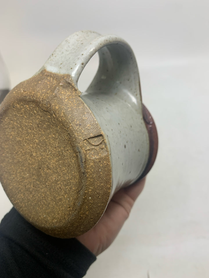 GREY SPECKLED SHORT POTTERY MUG W/ BROWN RIM.