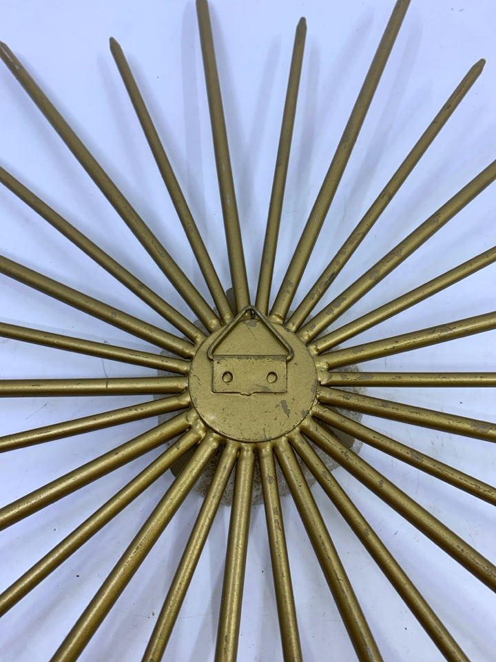 BRASS STARBURST W/ WHITE QUARTZ ROCK.
