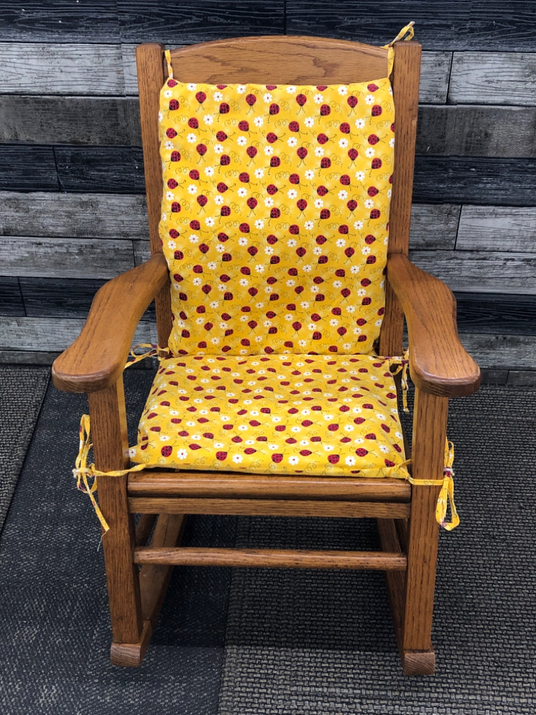 VTG KIDS WOOD ROCKING CHAIR W/LADYBUG CUSHIONS.