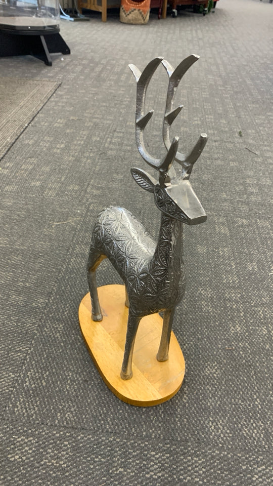 SILVER TEXTURED REINDEER W/WOOD BASE SCULPTURE.