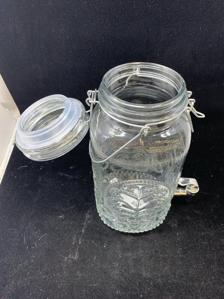 EMBOSSED CLEAR GLASS DRINK DISPENSER.