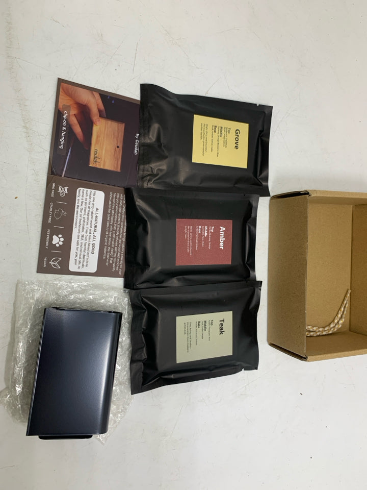NIB NATURAL WOOD SCENT AIR FRESHENER.