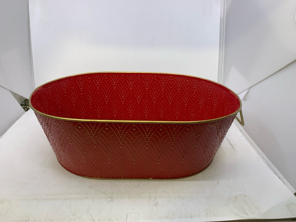 OVAL RED METAL W/ GOLD EMBOSSED DESIGNS.