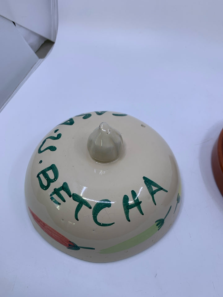 TERRA COTTA TORTILLA WARMER W/ PEPPERS ON IT.