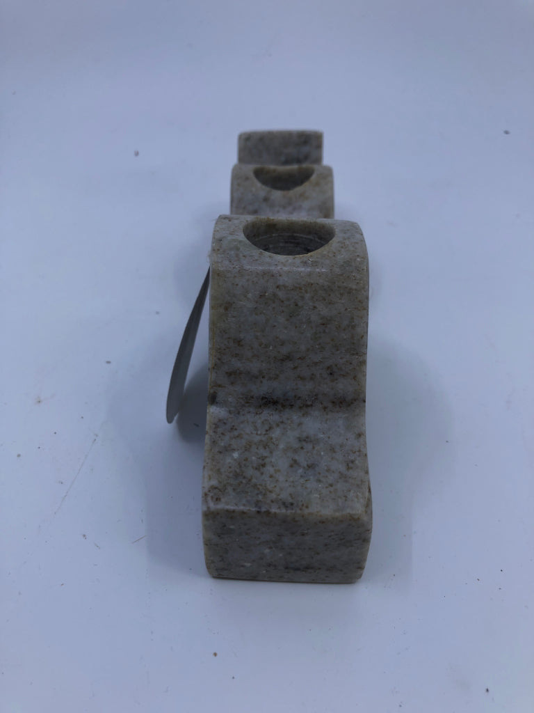 2 STONE WAVY TAPER CANDLE HOLDERS.