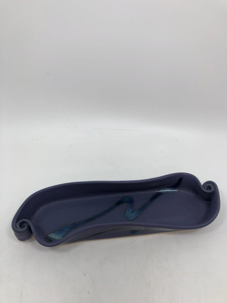 PURPLE STONEWARE DISH W/CURLED ENDS.
