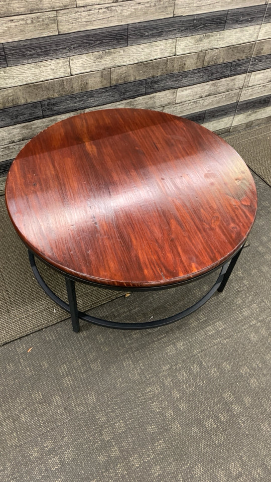 METAL BASE CHERRY WOOD CIRCLE COFFEE TABLE.