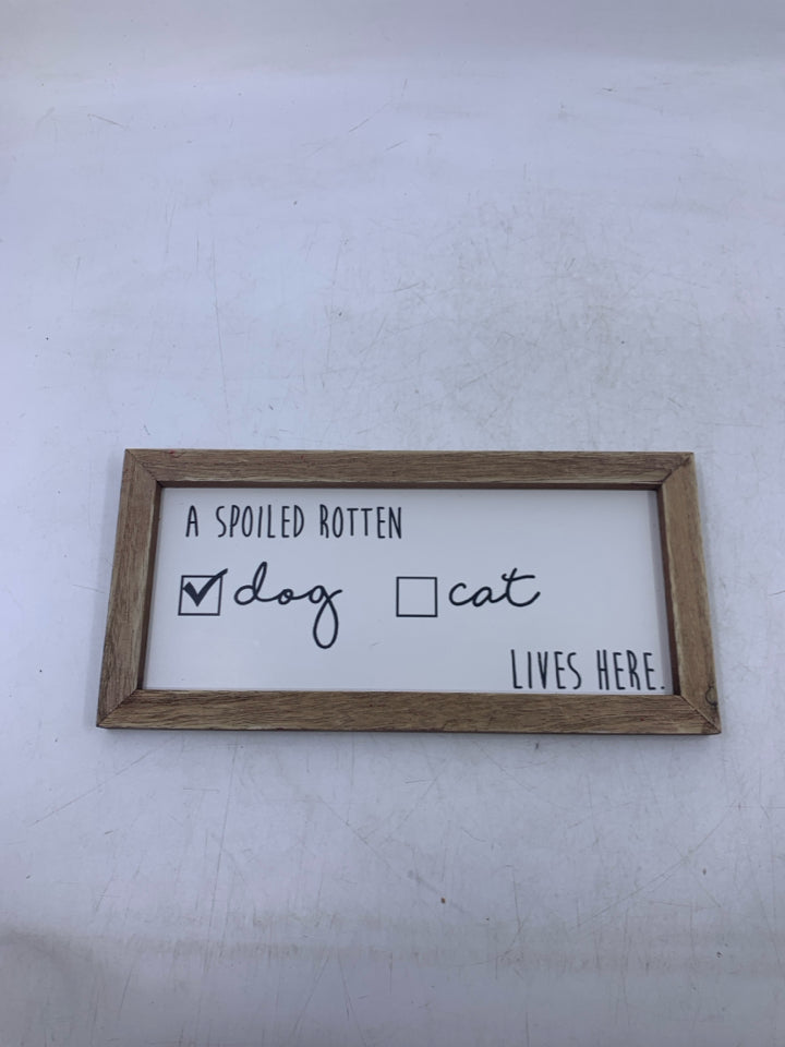 A SPOILED ROTTEN WALL HANGING.