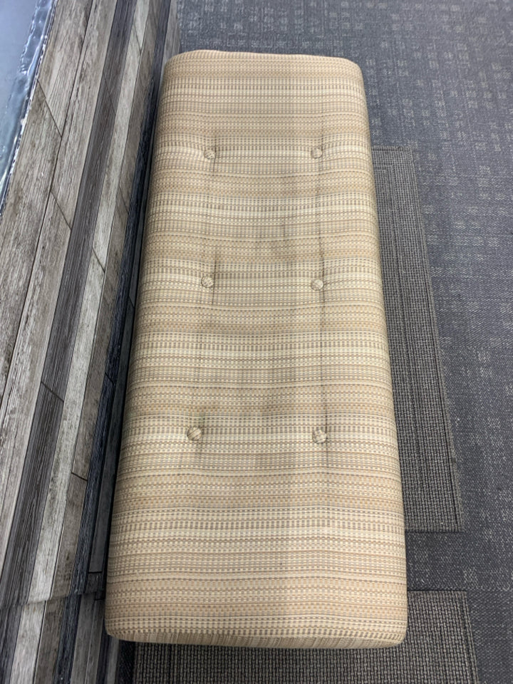 TAN OTTOMAN BENCH, SILK WEAVE TEXTURE W/BUTTON DETAIL.