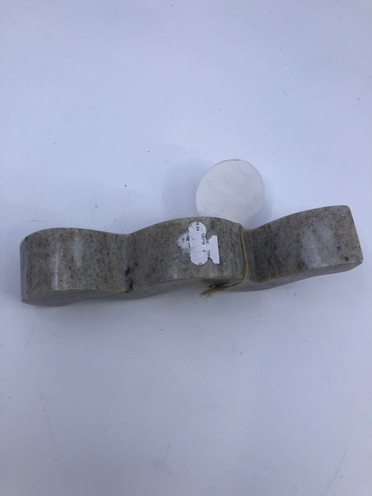 2 STONE WAVY TAPER CANDLE HOLDERS.