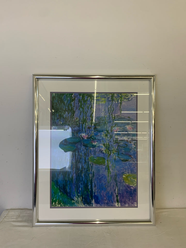 ABSTRACT LILY POND SCENE WALL HANGING IN SILVER FRAME.