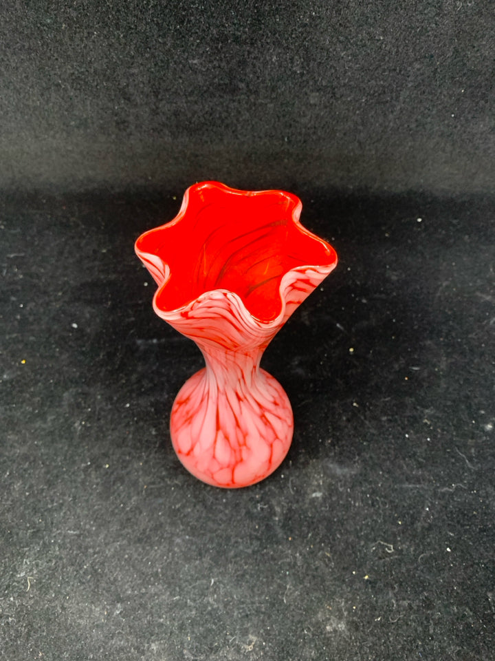 PALE RED SWIRL VASE W STAR SHAPED NECK.