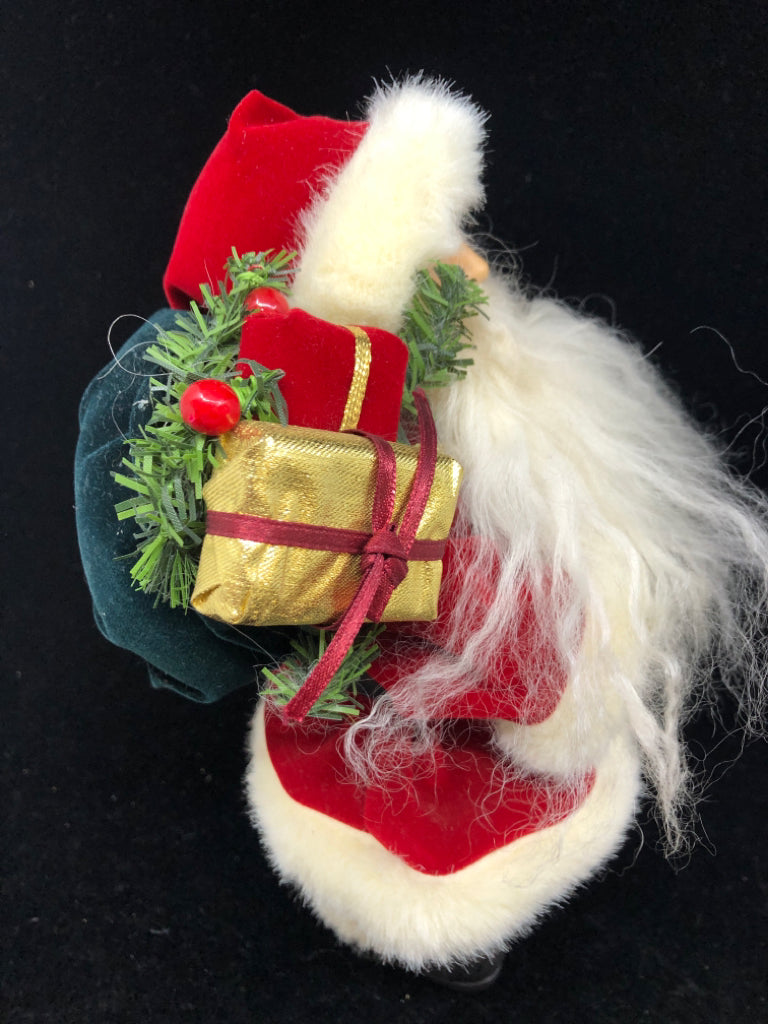 SANTA W/ LONG BEARD VELOUR RED SUIT HOLDING BAG OF PRESENTS.