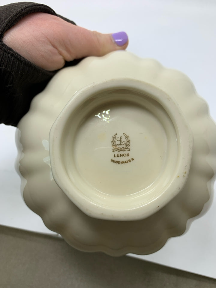 PORCELAIN FOOTED CANDY BOWL W/ UNEVEN EDGE.