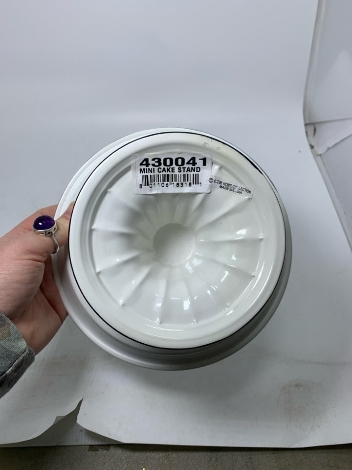 SHORT MINI ENAMEL CAKE STAND W/ BLACK EDGES.