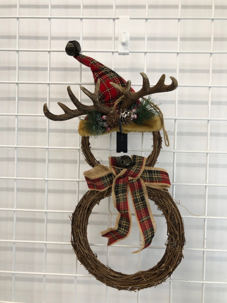 TWIG SNOWMAN W/ANTLERS HANGING.