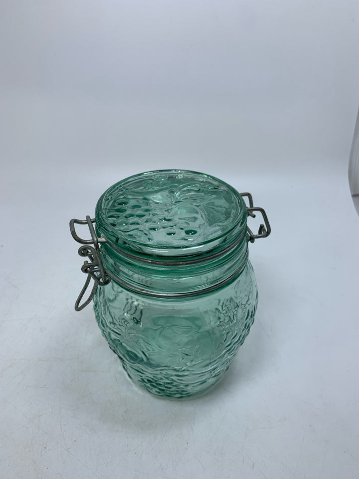 GREEN TINTED GLASS EMBOSSED FRUIT CANISTER.