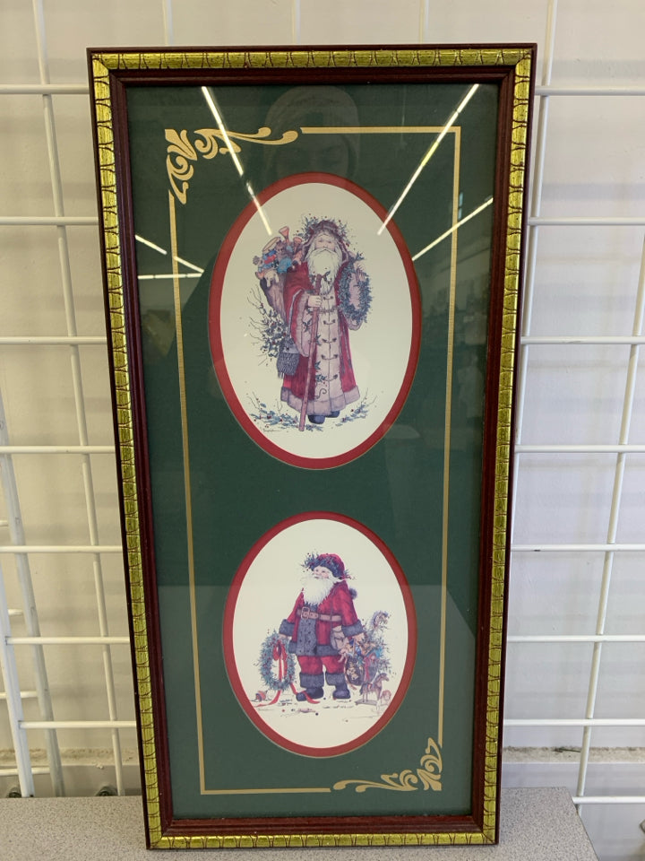 2 SANTAS IN CIRCLES GREEN WALL HANGING W/RED&GOLD FRAME.