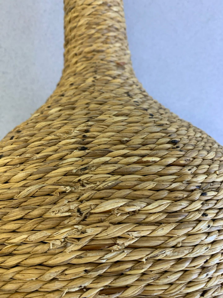 WOVEN RATTAN CANDLE HOLDER.