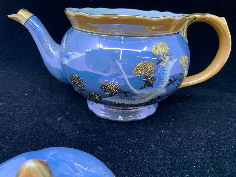 VTG TEAPOT PURPLE AND ORANGE W CRANE TEAPOT.