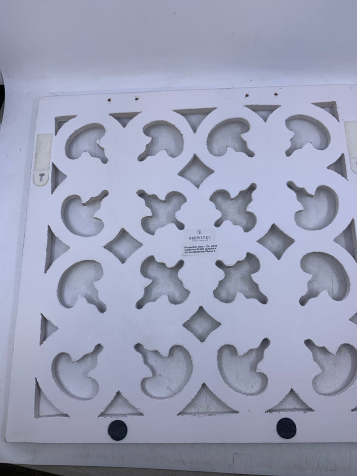 SQUARE WHITE WOOD CUTOUT WALL HANGING.