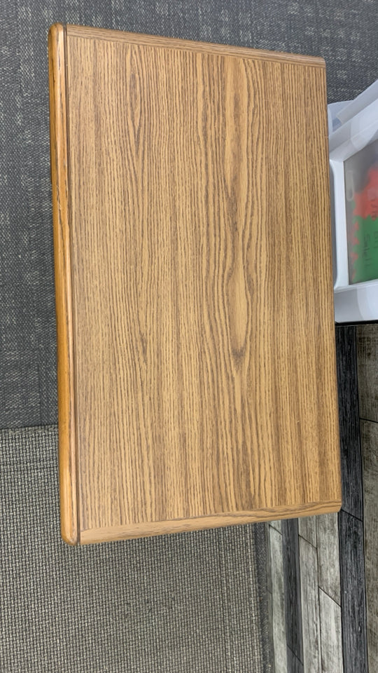 WOOD GRAIN TV STAND W/DOORS ON WHEELS.